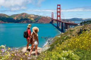 Couple Overlooking Golden Gate Bridge in San Francisco, California