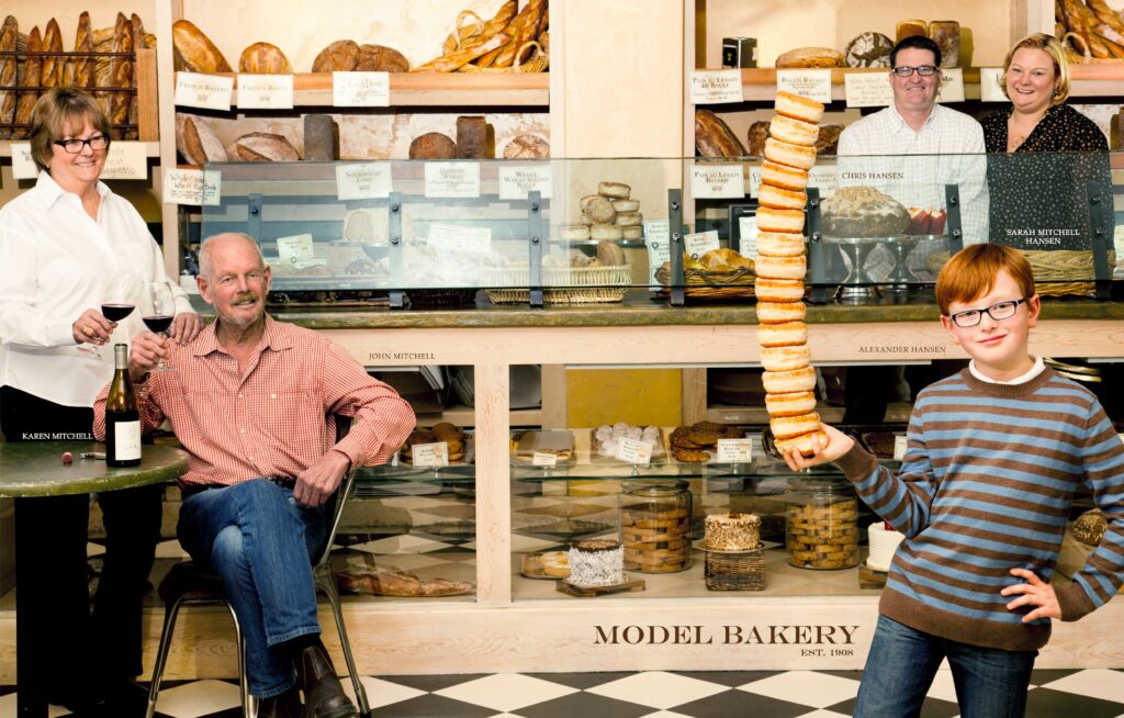 The team behind the Model Bakery Rad Recipe stands inside their iconic bakery. 