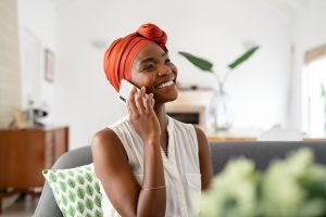 Woman having an 8-minute phone call to boost happiness in 2023.