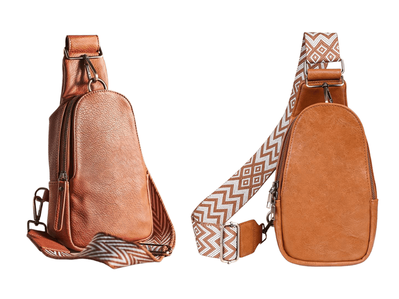 Two sling bags side by side. They feature the same amber leather look and embroidered strap. 