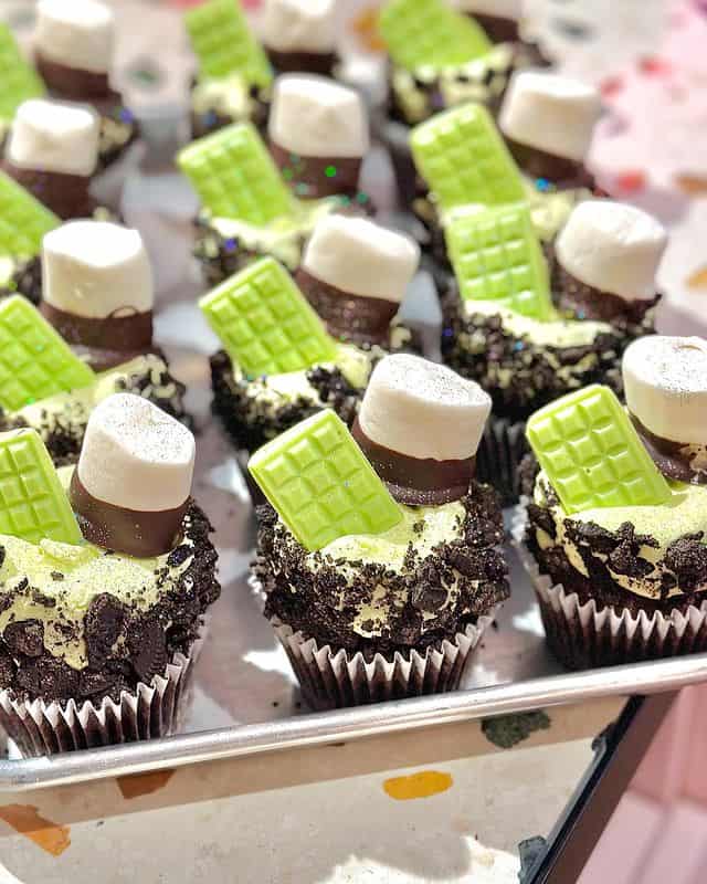 Chocolate cupcakes topped with a chocolate-dipped marshmallow. 
