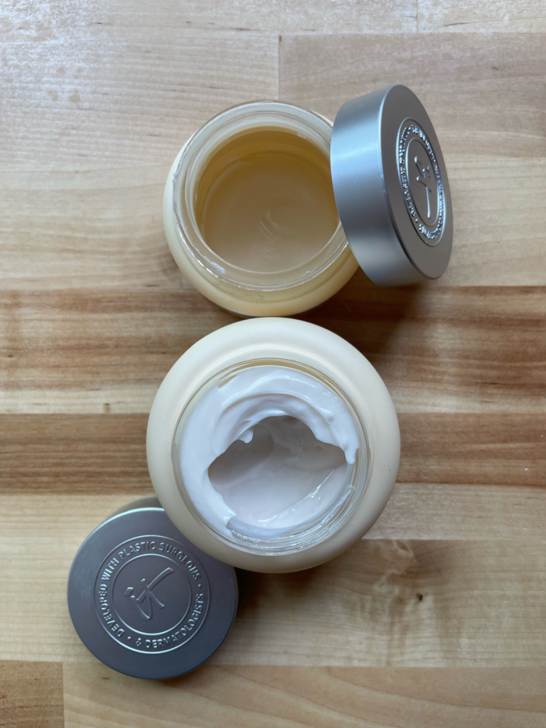 Two jars of It Cosmetics moisturizer. One is empty, but the other is full of a thick, white lotion. 