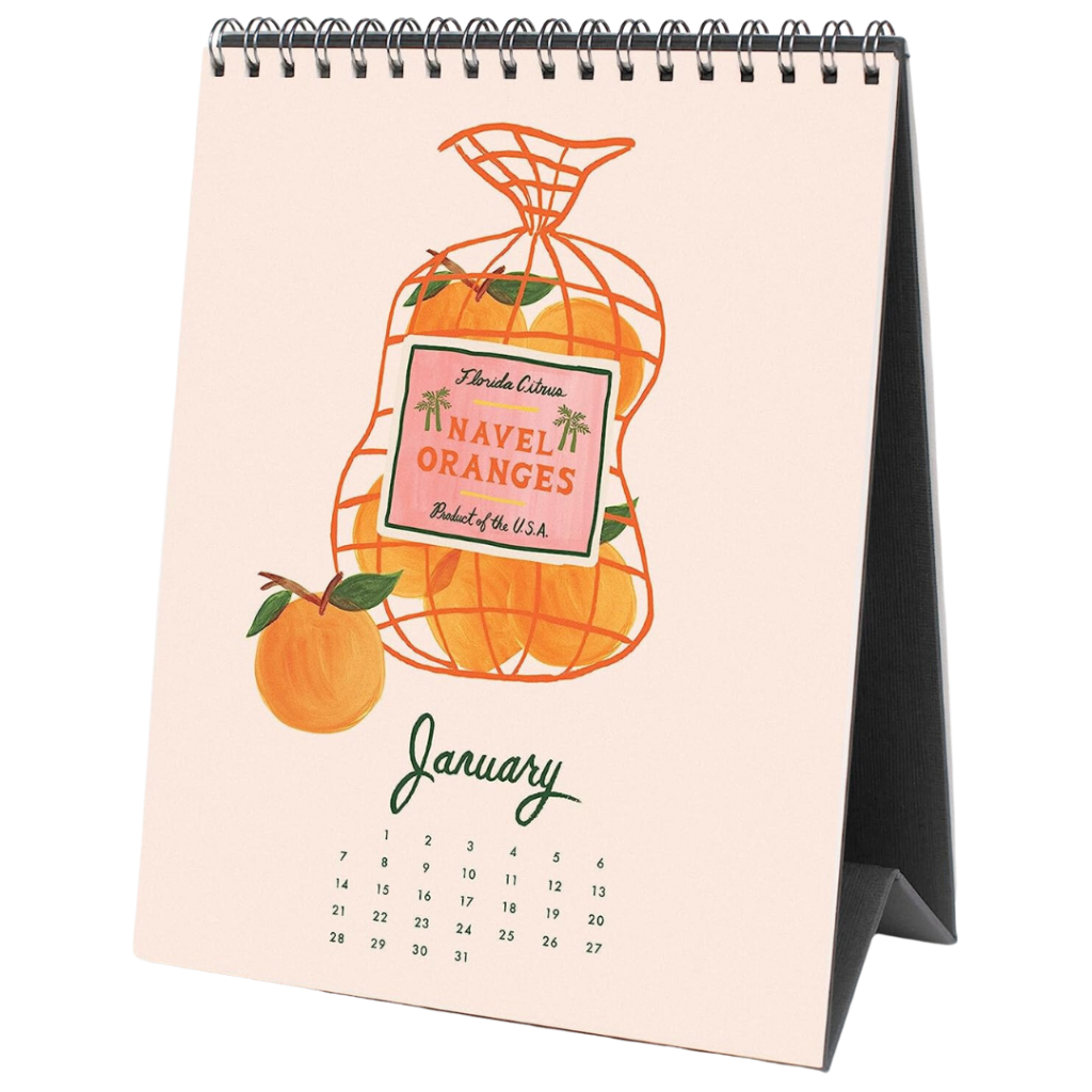 A standing desk calendar features an illustration with a bag of navel oranges. 